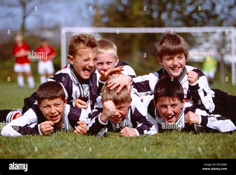 Children Sport Group Of Happy Boys Celebrating Victory At End Of