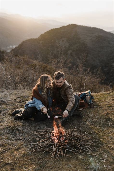 Couple Roasting Marshmallows At The Campfire · Free Stock Photo
