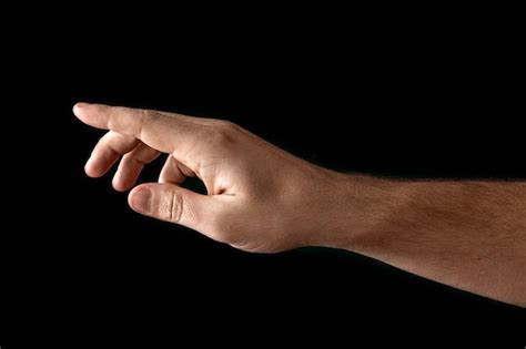 Premium Photo Man S Hand Touching Or Pointing To Something Isolated On Black