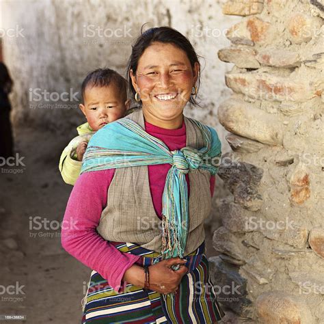 Nepali Woman Carrying Her Baby Stock Photo More Pictures Of Adult