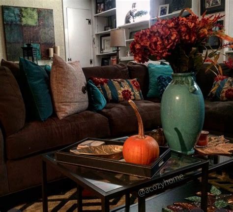It can be soothing as well as bold and vibrant and it can adapt to a variety of styles, ambiances and influences. Rustic fall living room decor, earth tones, fall decor ...