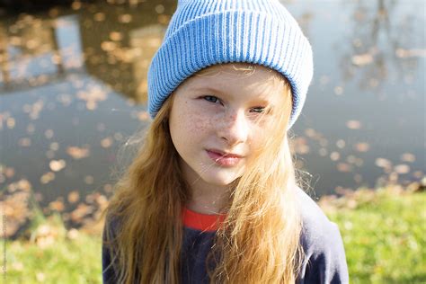 Little Girl With Freckles In The Park By Stocksy Contributor Irina