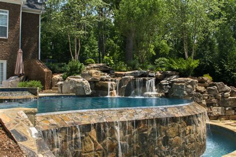 Negative Edge Pool With Waterfall And Natural Spa Traditional Pool