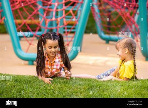 Happy Children Playing Outdoors Children On The Playground Stock Photo
