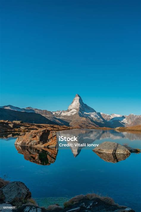 Panoramic Morning View Of Lake Stellisee With The Matterhorn Cervino