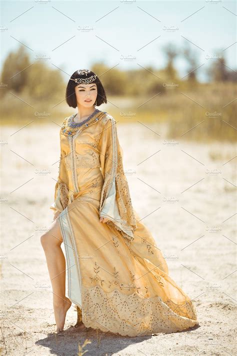 beautiful woman like egyptian queen cleopatra on in desert outdoor women short black
