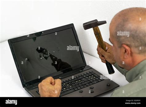 Man Breaking Pc With Hammer Stock Photo Alamy