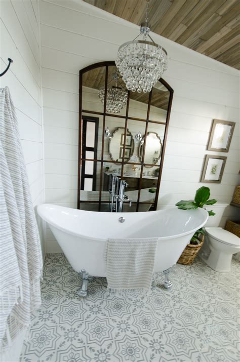 Audrey hall this tiny bathroom by envi interior design studio, via houzz, has more farmhouse than modern, but still meets the definition of a modern farmhouse.the small space is made to look bigger, thanks to a reflective tile in a neutral shade, and a large frameless mirror. Beautiful Urban Farmhouse Master Bathroom Remodel