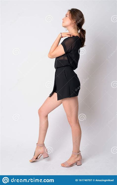 Full Body Shot Profile View Of Young Beautiful Woman Posing Stock Image