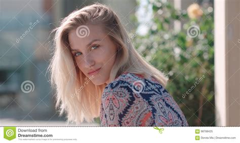 beautiful blonde girl looking at camera and smiling stock image image of camera adult 98788425