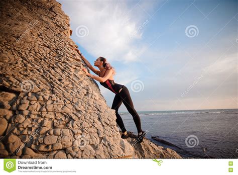 Female Rock Climber Climbs On Rocky Wall Stock Photo Image Of Holding
