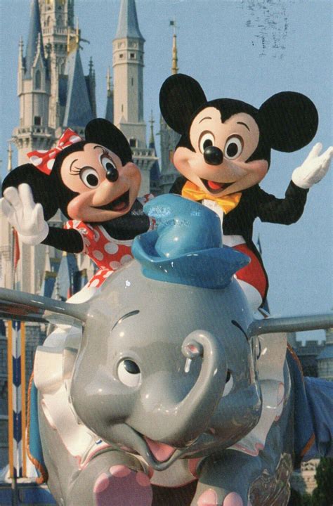 Mickey And Minnie Mouse On The Dumbo Ride At Walt Disney World