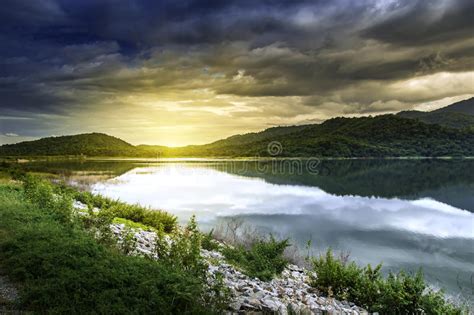 Mountain Peaks Reflection In Water Of A Lake In Summer Landscape Stock