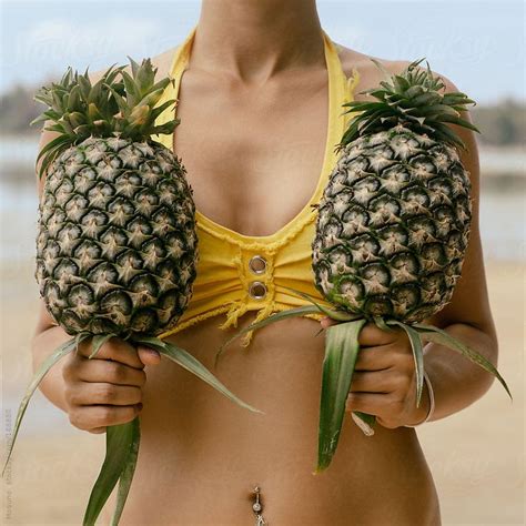Woman Holding Pineapple By Mosuno Stocksy Realstock Pineapple Women