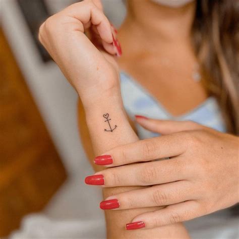 Minimalistic Tattoo Of An Anchor Located On The Wrist