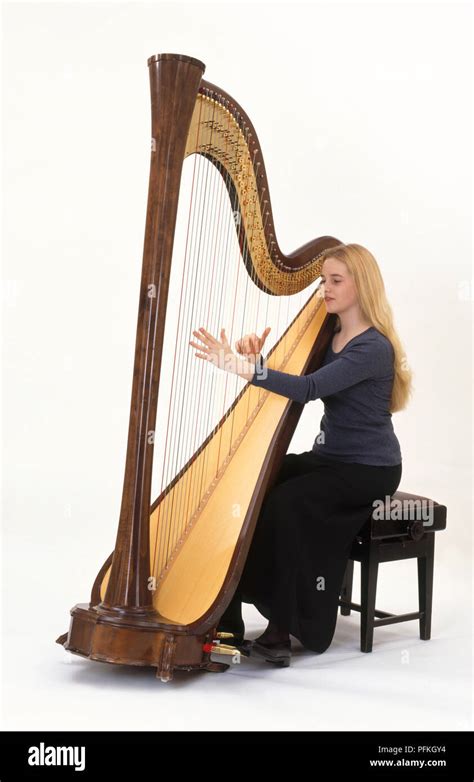 Teenage Girl Playing Harp Side View Stock Photo Alamy