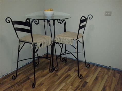 Wrought iron bistro table designs are meant to fit into small spaces, making every dining experience an intimate one. Wrought Iron Pub Table/2 Chairs | DiggersList