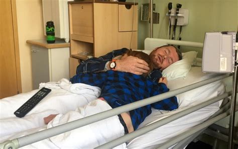 Heartbreaking Photo Of Father Dying Of Cancer Cradling His Young Son