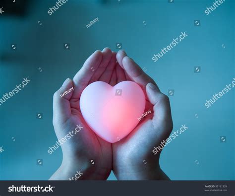 Love Concept Holding A Red Heart In Hands Stock Photo 95191339