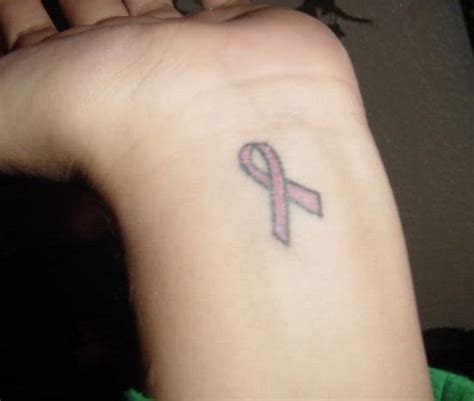 Cancer ribbon tattoos on the wrist. Tattoo Artist Gallery