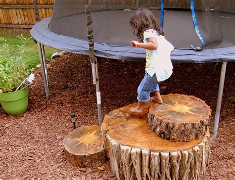 Spread the trampoline jump mat centered in the metal frame opening. "C" is for Crafty: Tree Stump Trampoline Steps
