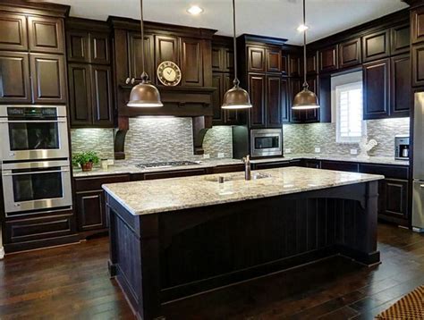 Break up the drama by adding white or neutral countertops and walls. 25 TRADITIONAL DARK KITCHEN CABINETS | Dark, Kitchens and ...