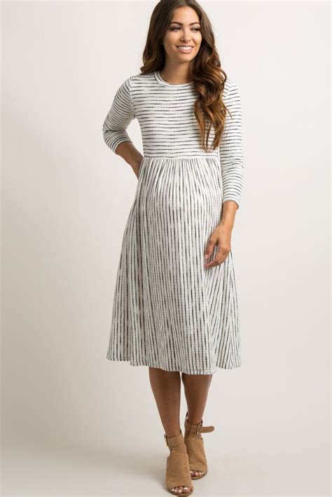 A Ribbed Striped Maternity Midi Dress Featuring A Pleated Skirt A