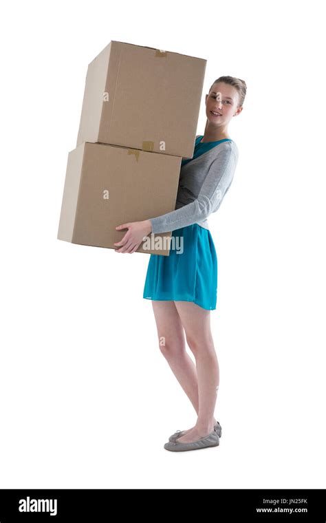 Teenage Girl Carrying Heavy Boxes Against White Background Stock Photo