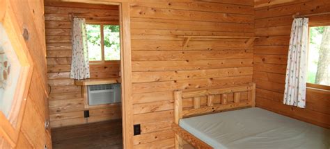 Units come furnished with beds, a couch, and a table and chairs. Monticello, Indiana Lodging | Indiana Beach / Monticello KOA