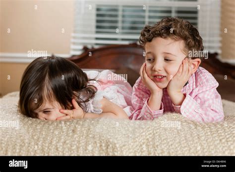 Children Laying On Bed Stock Photo Alamy