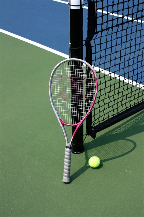 Tennis Free Stock Photo A Tennis Racquet And Ball On A Tennis Court