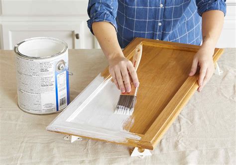 The oil primers tend to grip the old surface much. Painting Kitchen Cabinets | Better Homes & Gardens