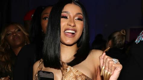 cardi b claps back at body shamers in epic video leave my rolls alone iheart