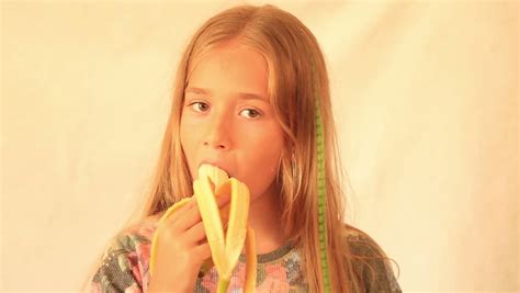 Cute Girl Eating Banana Stock Footage Video Royalty Free