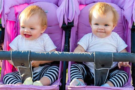 Two Beautiful Little Twin Babies Portrait In A Baby Stock Image