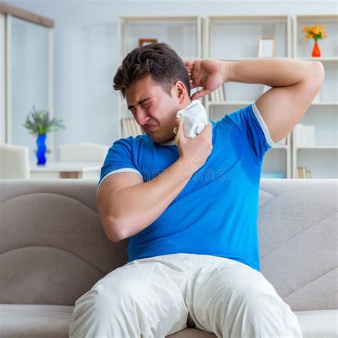 Man Sweating Excessively Smelling Bad At Home Stock Photo Image Of