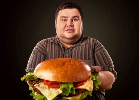 Fat Man Eating Fast Food Hamberger Breakfast For Overweight Person Stock Photo By Poznyakov