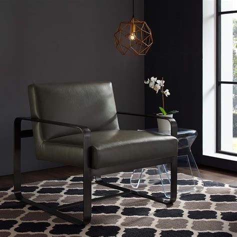The simplicity of swedish steel frame with the top quality 4mm vegetable tanned leather on it makes this armchair a dream who will last you a comfy lifetime. Astute Faux Leather Armchair Gray