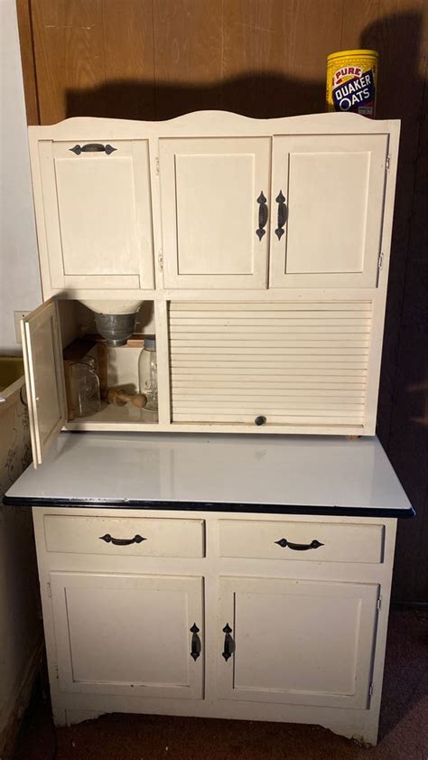 Maybe you would like to learn more about one of these? Antique Hoosier cabinet with metal enameled pull out table ...