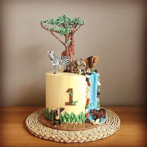 Wild African Themed First Birthday Cake Topped With African Animals