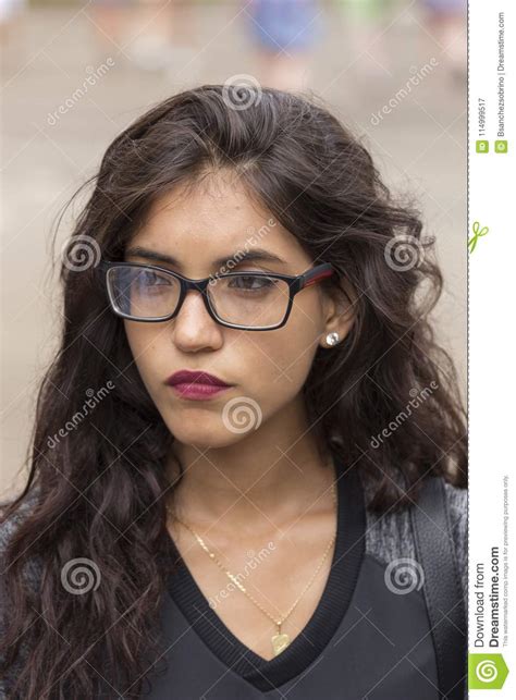 Portrait Of A Brunette Girl With Long Hair And Glasses Stock Image