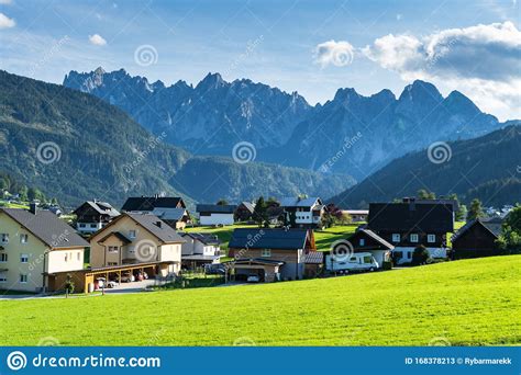 Gosau Is A Small Village In The Austrian Alps That Is Surrounded By A