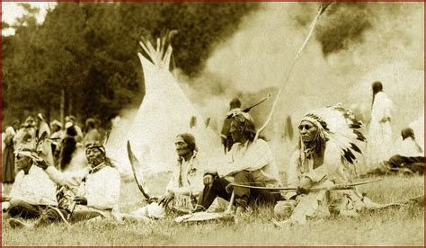 An Indian Camp In The Black Hills Featuring Lakota Sioux Chiefs Sitting On The Ground