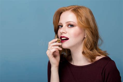 Brunette Eating Redhead