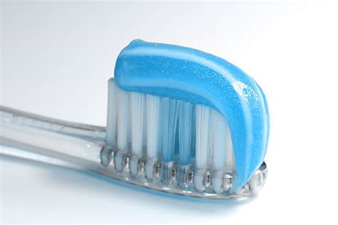 Blue Toothpaste On Toothbrush Stock Photos Pictures And Royalty Free
