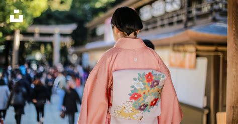 Woman In White And Red Floral Kimono Standing On Street During Daytime