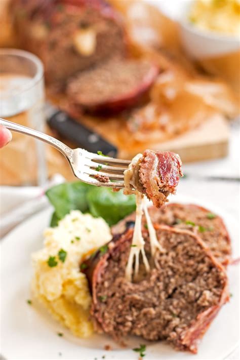 Get ready to serve up seconds and thirds. Mozzarella Stuffed Bacon Wrapped Meatloaf Recipe - This homemade meatloaf is stu… | Bacon ...