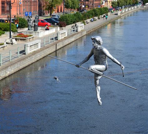 Balancing Sculpture Man Crossing The River Passes Through The River