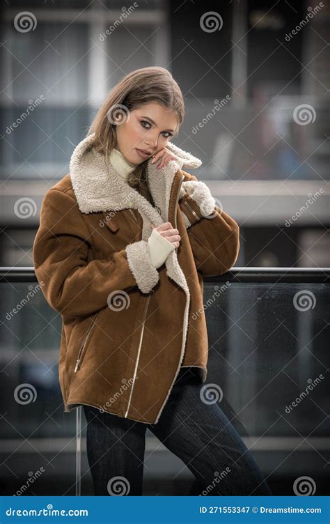 Attractive Blonde Model With Pantyhose Black Bra And Fur Coat Posing