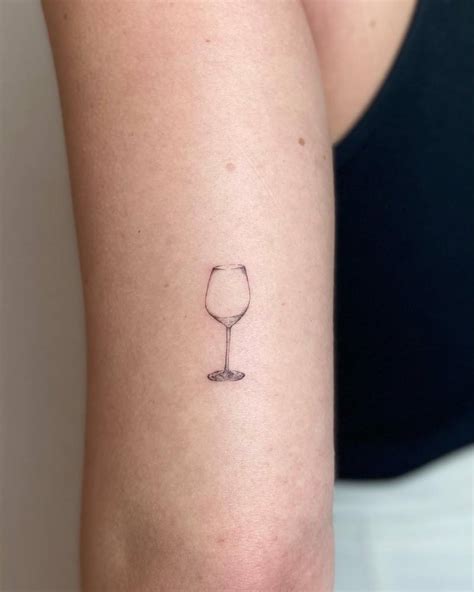 Micro Realistic Wine Glass Tattoo Done On The Tricep